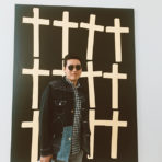 portrait of michael chang standing in front of a painting